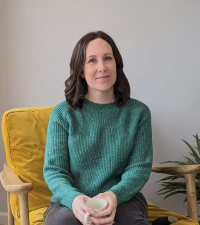 Green jumper yellow chair